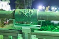 Sign of the zodiac Taurus on the bridge of the Wishing Bridge in the green light of a spotlight located on old city Yafo in Tel Av