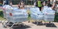 Tel Aviv Yafo, Israel - June 10, 2022. Shopping carts full of bottles of water stand outdoors in hot sunny weather