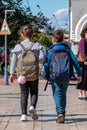 Telavi, Georgia - 07.10.2019: Two children, boy and girl going to school