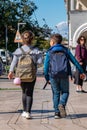 Telavi, Georgia - 07.10.2019: Two children, boy and girl going to school