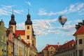 TELC, THE CZECH REPUBLIC-AUGUST 26, 2017: One hot air balloon flies over a medieval castle of Telc.