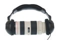 Tele lens using headphone Royalty Free Stock Photo