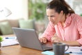 Tele worker suffering eyestrain using laptop at home Royalty Free Stock Photo