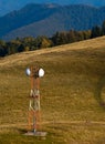 Telecommunication antenna (GSM) on mountain meadow Royalty Free Stock Photo