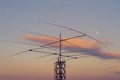 Telecommunication antenna on steel tower and twilight sky in background Royalty Free Stock Photo