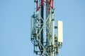 Telecommunication antennas outdoor on the tall metal pole construction. Royalty Free Stock Photo