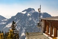 Telecommunication antennas on the roof of a building among the snowy mountains Royalty Free Stock Photo