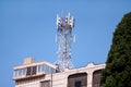 Telecommunication base stations network repeaters on the roof of building. The cellular communication aerial on city building roof Royalty Free Stock Photo