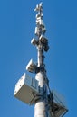 Telecommunication cell tower antenna against blue sky. Wireless communication and modern mobile internet. Royalty Free Stock Photo