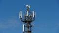 Telecommunication cellular tower against blue sky