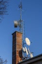 Telecommunication devices on a brick chimney Royalty Free Stock Photo