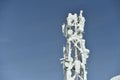 Telecommunication GSM internet and telecomunication data scaffolding antenna on top of the mountain. Royalty Free Stock Photo