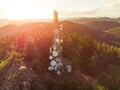 Telecommunication mast television antennas on mountains at sunset Royalty Free Stock Photo