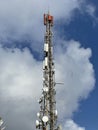 Telecommunication and mobile network infrastructure with two cell site towers side by side, housing antennas and Remote