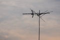 Telecommunication pole with sky at dawn.