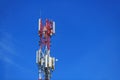 Telecommunication pylon with signal repeaters and antennas against blue sky for wireless technology and broadcasting industry