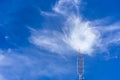 Telecommunication radio wave signal tower red and white with cloudy. Steel truss of transmission signal antenna with blue sky. Royalty Free Stock Photo