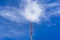 Telecommunication radio wave signal tower red and white with cloudy. Steel truss of transmission signal antenna with blue sky. Royalty Free Stock Photo