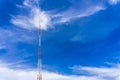 Telecommunication radio wave signal tower red and white with cloudy. Steel truss of transmission signal antenna with blue sky. Royalty Free Stock Photo