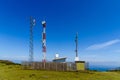 Telecommunication and telephone antenna in green landscape Royalty Free Stock Photo