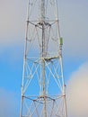 Cell antenna, transmitter. Telecom TV radio mobile tower against blue sky Royalty Free Stock Photo