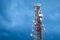 Telecommunication tower against cloudy blue sky Royalty Free Stock Photo