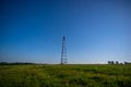 Telecommunication tower against the starry sky in the field Royalty Free Stock Photo