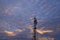 Telecommunication tower Antenna and satellite dish at sunset sky Royalty Free Stock Photo