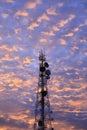 Telecommunication tower Antenna and satellite dish at sunset sky Royalty Free Stock Photo