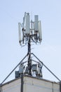 Telecommunication tower with antennas and transmitters on the roof Royalty Free Stock Photo