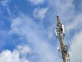 Telecommunication tower with antennas under blue sky. Royalty Free Stock Photo