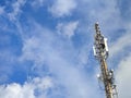 Telecommunication tower with antennas under blue sky. Royalty Free Stock Photo