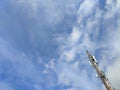 Telecommunication tower with antennas under blue sky. Royalty Free Stock Photo