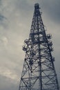 A telecommunication tower became silhouette line stand out from white sky in twilight time Royalty Free Stock Photo