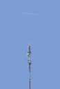 Telecommunication tower on blue sky background. Royalty Free Stock Photo