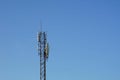 A telecommunication tower with blue sky background, comunications concepts. Royalty Free Stock Photo