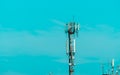 Telecommunication tower with blue sky background. Radio and satellite pole. Communication technology. Telecommunication industry