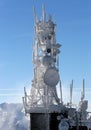 Telecommunication tower frozen under blue sky Royalty Free Stock Photo