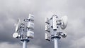 Telecommunication tower with 5G cellular network antenna against stormy sky with clouds, 3d rendering