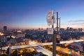 Telecommunication tower with 5G cellular network antenna on night city background Royalty Free Stock Photo