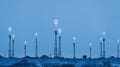 Telecommunication towers on hill with location signal sign