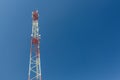 Telecommunication tower or mast with microwave, radio panel antennas, outdoor remote radio units, power cables, coaxial Royalty Free Stock Photo