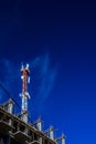 Telecommunication tower on top of under construction building Royalty Free Stock Photo