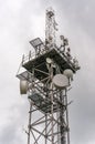 Telecommunication tower with transmitters antennas and parabolas Royalty Free Stock Photo