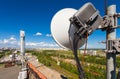 Telecommunication tower with wireless communications systems are including microwave, panel antennas, fiber, optic and power cabl Royalty Free Stock Photo