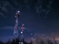 Telecommunication towers in the background of night starry sky Royalty Free Stock Photo