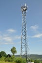 Telecommunication towers on a green hill Royalty Free Stock Photo