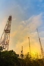 Telecommunication towers on the summit of the hill under cloudy Royalty Free Stock Photo