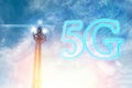 Telecommunications antenna against a clear blue sky with the image of a chip and 5G. The concept of communication, technologies