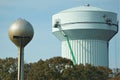 Workers install 5G technology on water tower